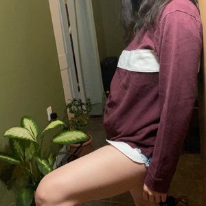 Maroon shirt with a white strips